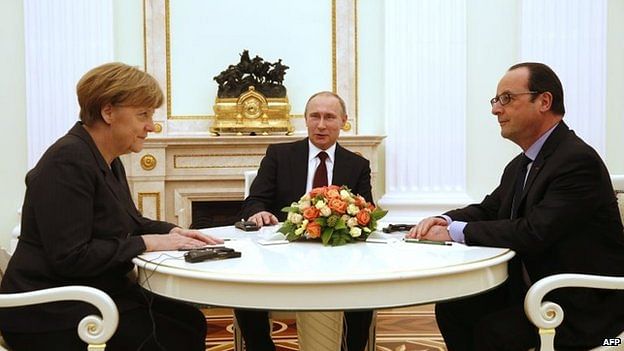 Merkel and Hollande (right) met Putin in Moscow on Friday. Photo: AFP