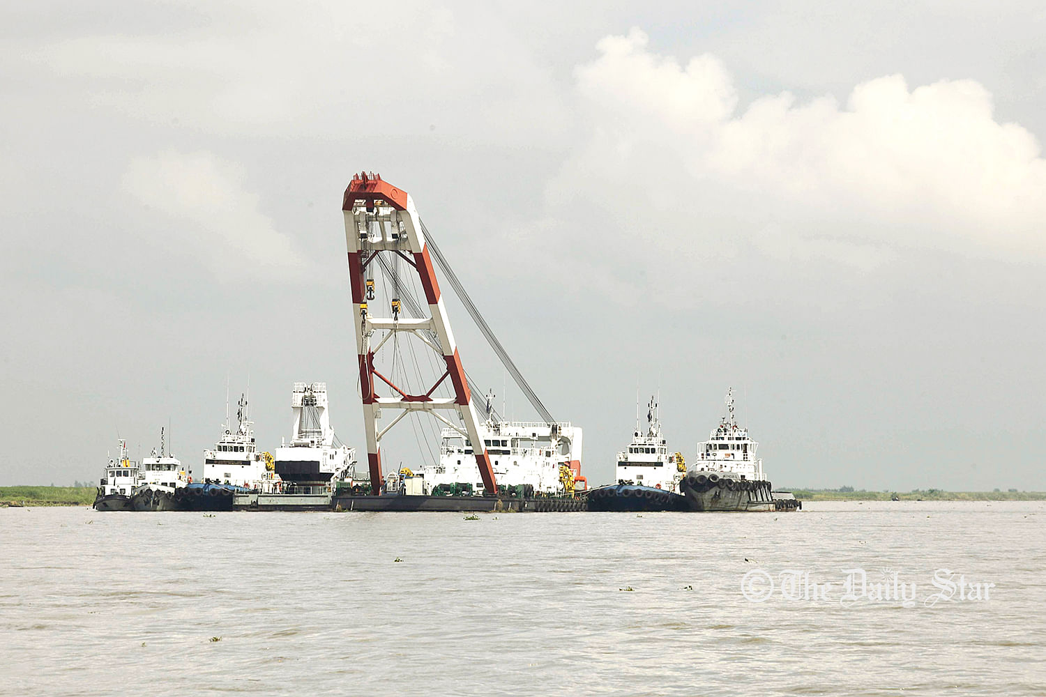 The vessels conducting rescue drives in Padma on Thursday to indentify the sunken launch. Photo: Star file