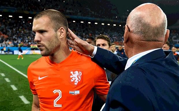 Holland v Argentina, World Cup semi-final: Dutchman Ron Vlaar is consoled after missing his penalty in the shootout. Photo: Getty Images