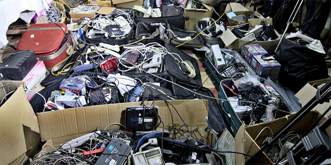 This December 22, 2013 photo shows huge quantity of Voice over Internet Protocol (VoIP) equipments seized by members of Rapid Action Battalion in an Uttara house.
