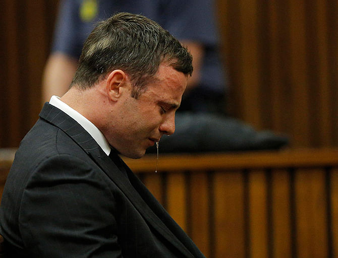 Olympic and Paralympic track star Oscar Pistorius reacts as he listens to Judge Thokozile Masipa's judgement at the North Gauteng High Court in Pretoria, September 11, 2014. Photo: Reuters