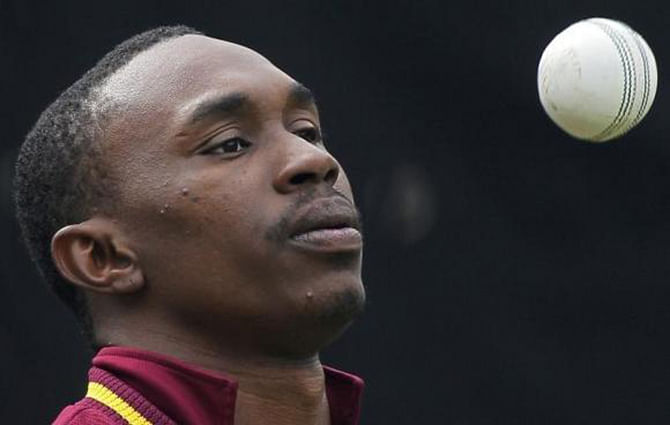 West Indies' Dwayne Bravo tosses the ball as he prepares to bowl in the nets during a cricket practice session in New Delhi February 22, 2011. Photo: Reuters 