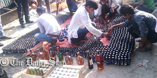 Police seize the Phensedyl, foreign liquor, beer, yaba tablets and several sharp weapons Friday from five shops of Nur Hossain, the prime accused of Narayanganj panel mayor Nazrul Islam killing. Photo: Star