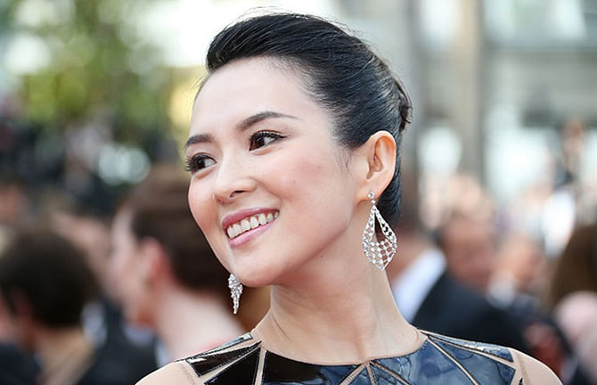 Chinese actress Zhang Ziyi posing as she arrives for the opening ceremony of the 67th edition of the Cannes Film Festival in Cannes